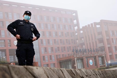 A security guard on watch in the mist.