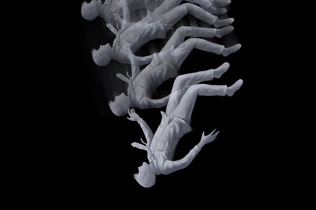 Conceptual illustration of a person falling in the dark, depicted with multiple images of the person in different positions as they fall