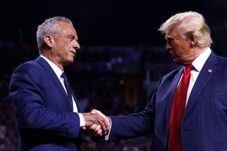 President-elect Donald Trump is greeted by Robert F. Kennedy Jr. on stage during a campaign event at Desert Diamond Arena in Glendale, Arizona, on August 23, 2024.