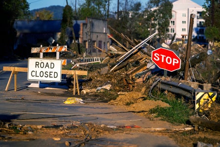 "Road Closed" and "STOP" sign and debris in Asheville N.C.