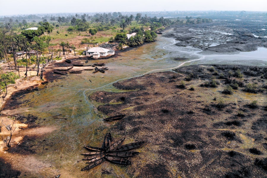 Aerial view of crude oil pollutes the shoreline of an estuary