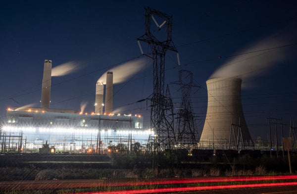 Steam rises from the Miller coal Power Plant.