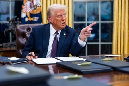 US President Donald Trump speaks while signing executive orders in the Oval Office.